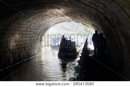 Bath, Great Britain - Dec 25, 2018: Narrow Boat In A Tunnel In The Kennet And Avon Canal  In The Cit