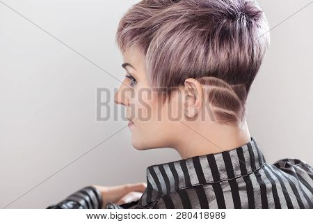 Portrait Of A Beautiful Blonde Woman With Beautiful Make-up And Short Haircut After Dyeing Hair In A