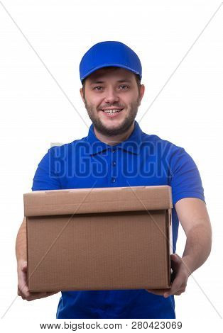 Image Of Smiling Man In Blue T-shirt And Baseball Cap With Cardboard Box On White Background