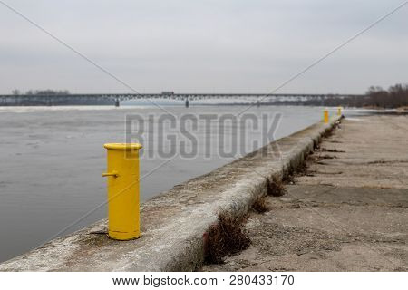 A Bridge Over A Large River. Crossing For Passenger Cars Over The Vistula. Season Winter.