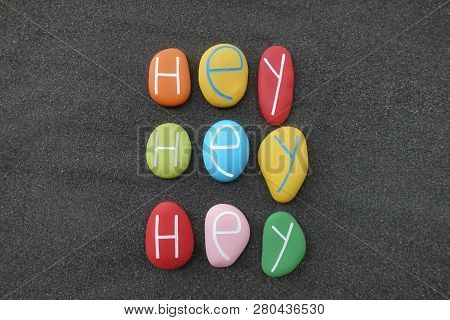 Hey, Hey, Hey, Trendy Text With Colored Sea Stones Over Black Volcanic Sand