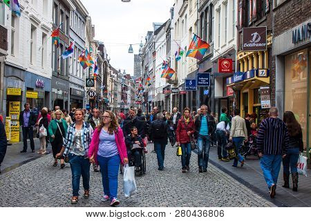 Maastricht, Jun 1: Unidentified People Walk On A Street In Maastricht, Netherlands On Jun 1, 2013. M