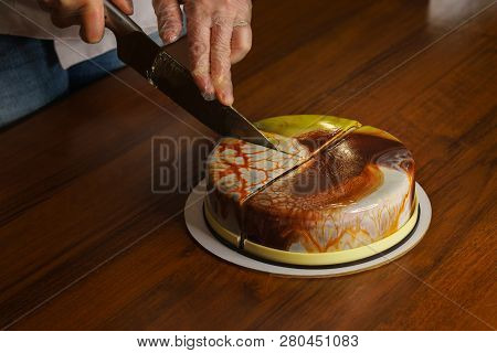 Confectioner Cuts Dacquoise Cake In Mirrored Glaze. Home Cooking. Modern Cooking