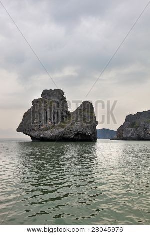 Foggy morning after a storm. The well-known island-rock 