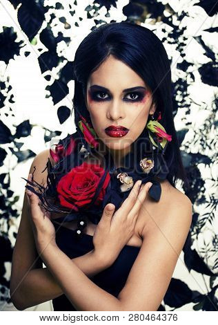 Pretty Brunette Woman With Rose Jewelry, Black And Red, Bright Make Up Kike A Vampire Closeup Red Li