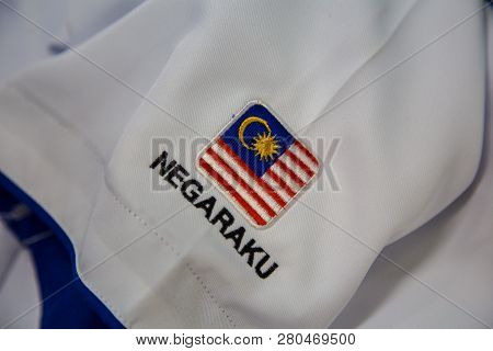 Close-up Of Embroidery Malaysia Logo With Wording Negaraku (my Country) On White Uniform