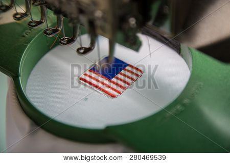 Close-up Of Embroidery Malaysia Logo With Wording Negaraku (my Country) On White Uniform