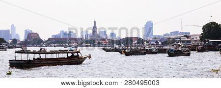 Thai Riverside Naval Commuter Traffic In Chao Phraya River With Wat Arun (temple Of Dawn) Background