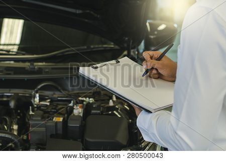 This Career Man Saleman Business Inspection Writing Note On Notepad Or Book, Paper With Car Blurry B