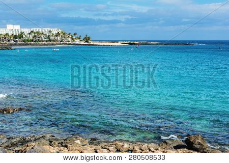 View Of Playa De Las Cucharas Beach In Costa Teguise, Lanzarote, Spain, Turquoise Waters, Selective 