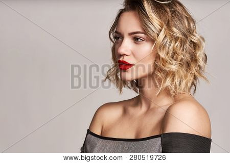 Beautiful Stylish Woman With Red Lips Looking At Camera