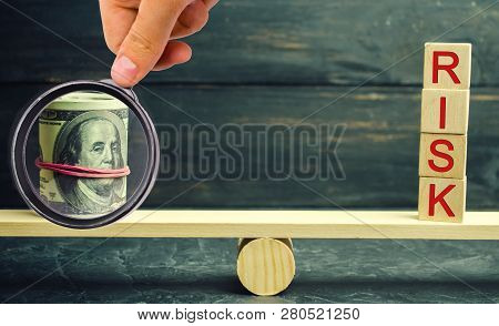 Dollars And The Inscription Risk Are On The Scales. The Concept Of Financial And Economic Risk. Unre
