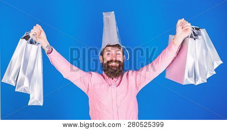 Man With Long Beard And Funny Look Isolated On Blue Background. Hipster With Trendy Beard Shopping D