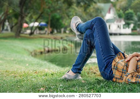 Feet Woman Rest And Sleeping On The Park, Relax Time On Holiday.