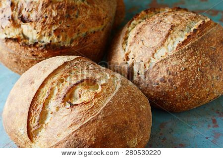 Fresh Homemade Bread On A Gray-blue Background, With Flax Seeds On Whole Wheat Flour. French Bread R