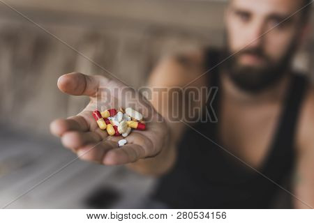Close Up Of A Handful Of Different Pills And Capsules. Selective Focus On The Pills