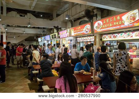 Singapore, Singapore - January 31, 2015: People Enjoying Food At The Lau Pa Sat Foodcourt.