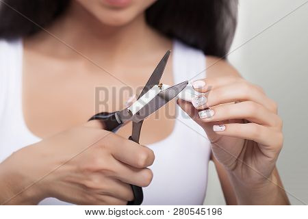 Stop Smoking The Concept. Young Beautiful Woman Cutting Cigarettes With Scissors Smiles, Isolated On