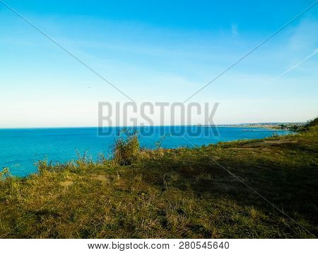 Baltic Sea From Cliff In Mechelinki, Poland. Nature And Travel Concept. Copy Space On Blue Sky.