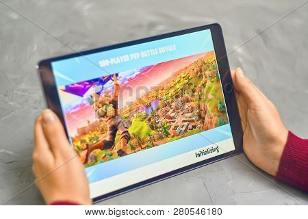 Bishkek, Kyrgyzstan - January 21, 2019: Woman Playing Fortnite Game Of Epic Games Company On Apple I