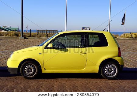 Noordwijk, The Netherlands - Januari 20, 2019: Yellow Volkswagen Lupo Parked By The Side Of The Road