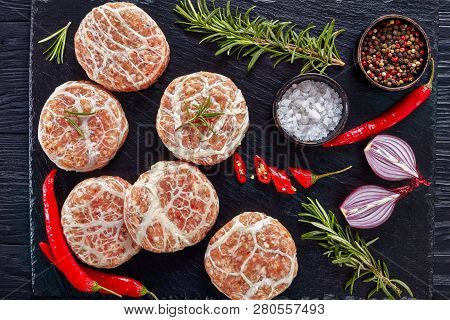 Uncooked Atriaux - Ground Pork Wrapped In Caul Fat, Swiss Cuisine, Type Of Bratwurst On A Slate Tray