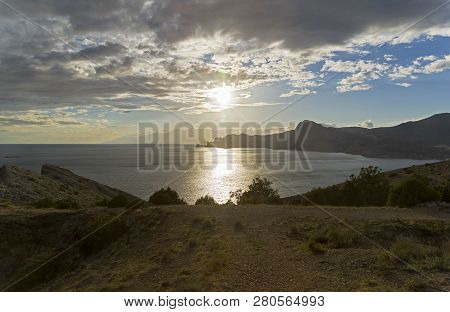 The Evening Sun Is Reflected In The Sea. View From The Top Of Alchak Cape. Sudak, Crimea, September.