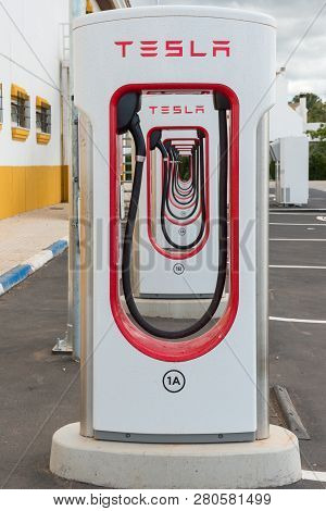 Aguadulce, Seville, Spain - April 29, 2018: A Tesla Electric Supercharger Stand At A Gas Station In 