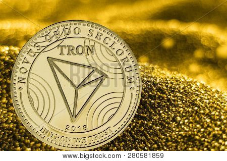 Coin Cryptocurrency Tron And Gold Fabric Background. Trx