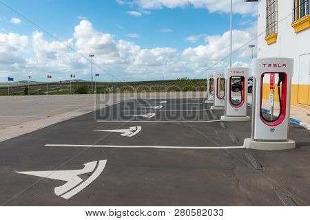 Aguadulce, Seville, Spain - April 29, 2018: A Tesla Electric Supercharger Stand At A Gas Station In 