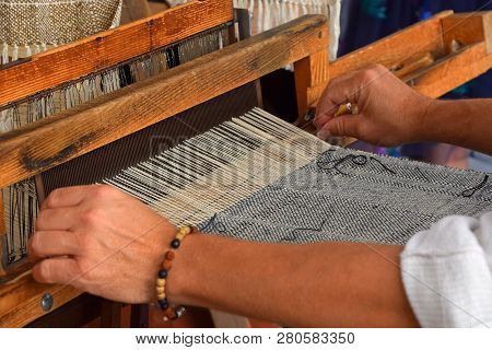 Close Up Man Hands Weave Canvas With Antique Loom Handweave Machine, Side View