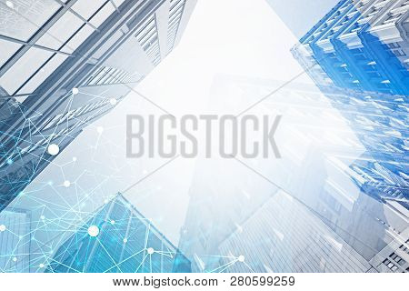 Immersive Interface With Glowing Blue Polygons In City Sky With Double Exposure Of Skyscrapers. Conc