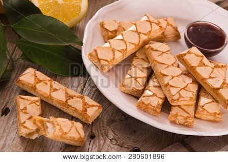Puff Pastry Cookies With Jam On White Dish.