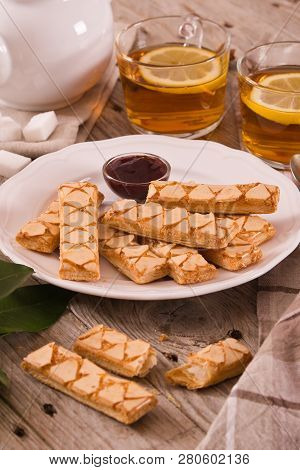 Puff Pastry Cookies With Jam On White Dish.