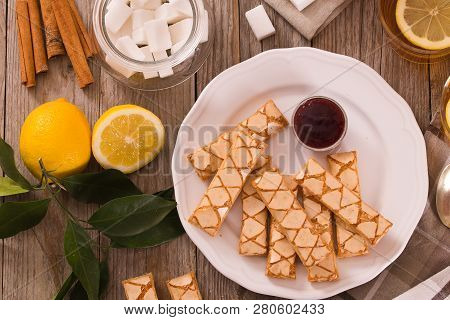 Puff Pastry Cookies With Jam On White Dish.