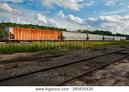 Boxcars Sitting On The Track Waiting On The Locomotive