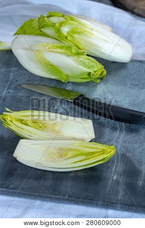 Group Of Fresh Raw Green Belgian Endive Or Hicory Vegetables, Also Known As Witlof Salade
