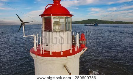 White Lighthouse With Red Roof On Tokarev Cat. Vladivostok, Russia