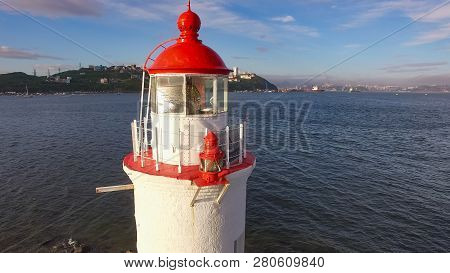 White Lighthouse With Red Roof On Tokarev Cat. Vladivostok, Russia