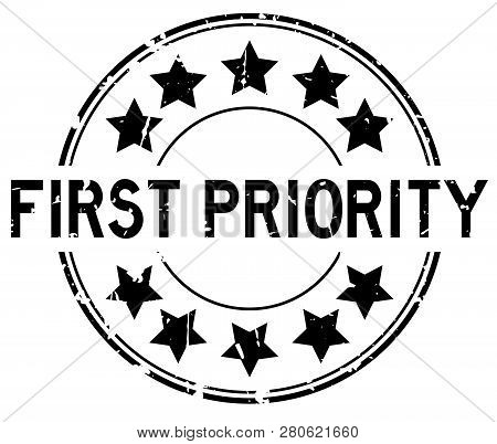 Grunge Black First Priority Word With Star Icon Round Rubber Seal Stamp On White Background