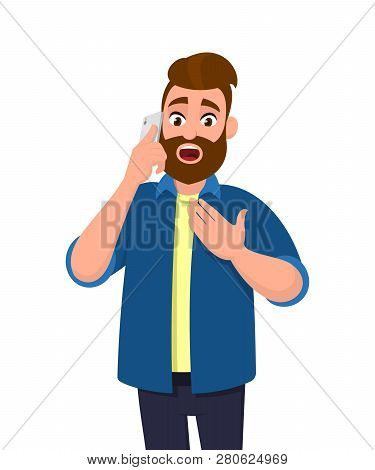 Man Is Talking On The Cell Phone With Shocking Expression. Bearded Man Holding Hand On Chest While S