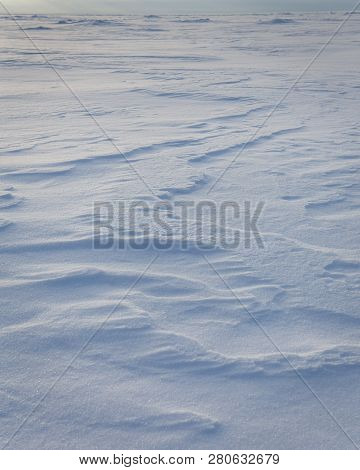 Wind Shapes Of Snow On Froozen Sea. Russia