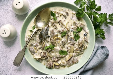 Beef Stroganoff - Meat Stewed In Cream Sauce With Mushrooms.top View With Copy Space.