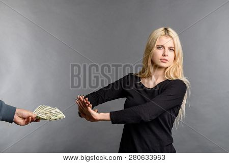 Pretty Blonde Girl Rejects Money Dollars Banknotes Woman Does Not Take Money, Refusing To Accept Bri