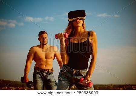 Vr Simulator For Fitness. Woman Wear Vr Glasses Build Muscles With Dumbbells. Vr Stimulator For Bett