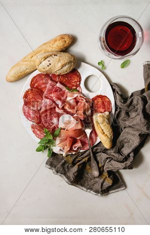 Antipasto Meat Platter Assorti Of Sliced Jamon, Salami, Chorizo Sausage On White Ceramic Board With 