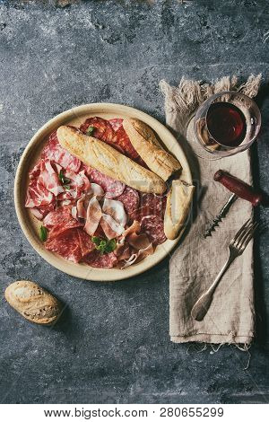 Antipasto Meat Platter Assorti Of Sliced Jamon, Salami, Chorizo Sausage In Ceramic Plate With Bread 