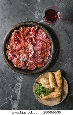 Antipasto Meat Platter Assorti Of Sliced Jamon, Salami, Chorizo Sausage In Terracotta Tray With Brea