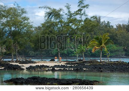Native Fisherman On A Tropical Lagoon Island In The Pacific Ocean