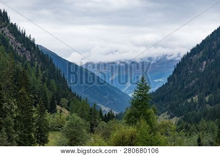 Mountains, Peaks, Lake, Everlasting Ice And Trees Landscape. Kaunertaler Gletscher Natural Environme